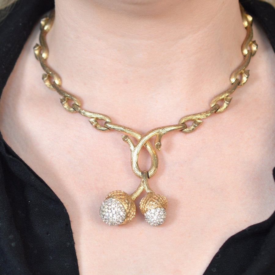 Mid-century Trifari gold-tone necklace with stylized branches and rhinestone acorns, vintage 1950s costume jewelry.