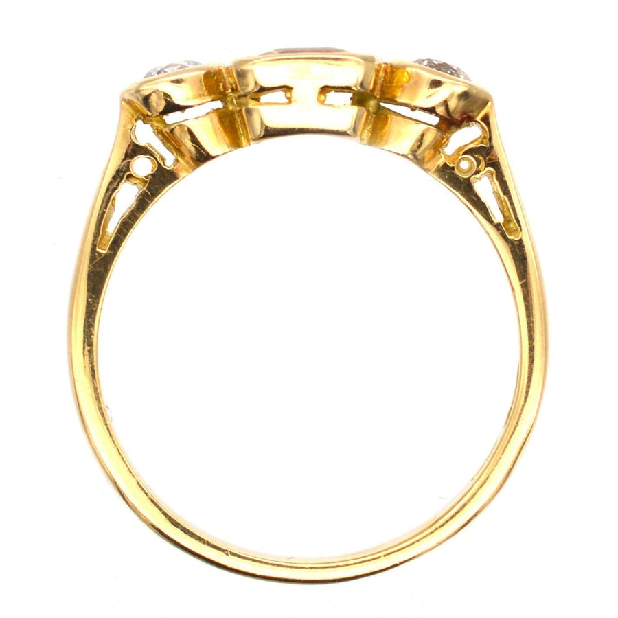 Modern 18ct gold three stone ring featuring yellow sapphire and white diamonds, showcasing intricate band details.