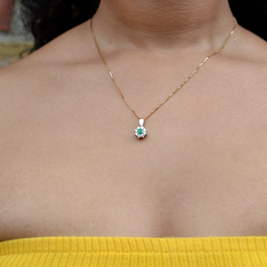 Modern 18ct gold chain with a green pendant displayed on a person's neck, highlighting its stylish elegance.