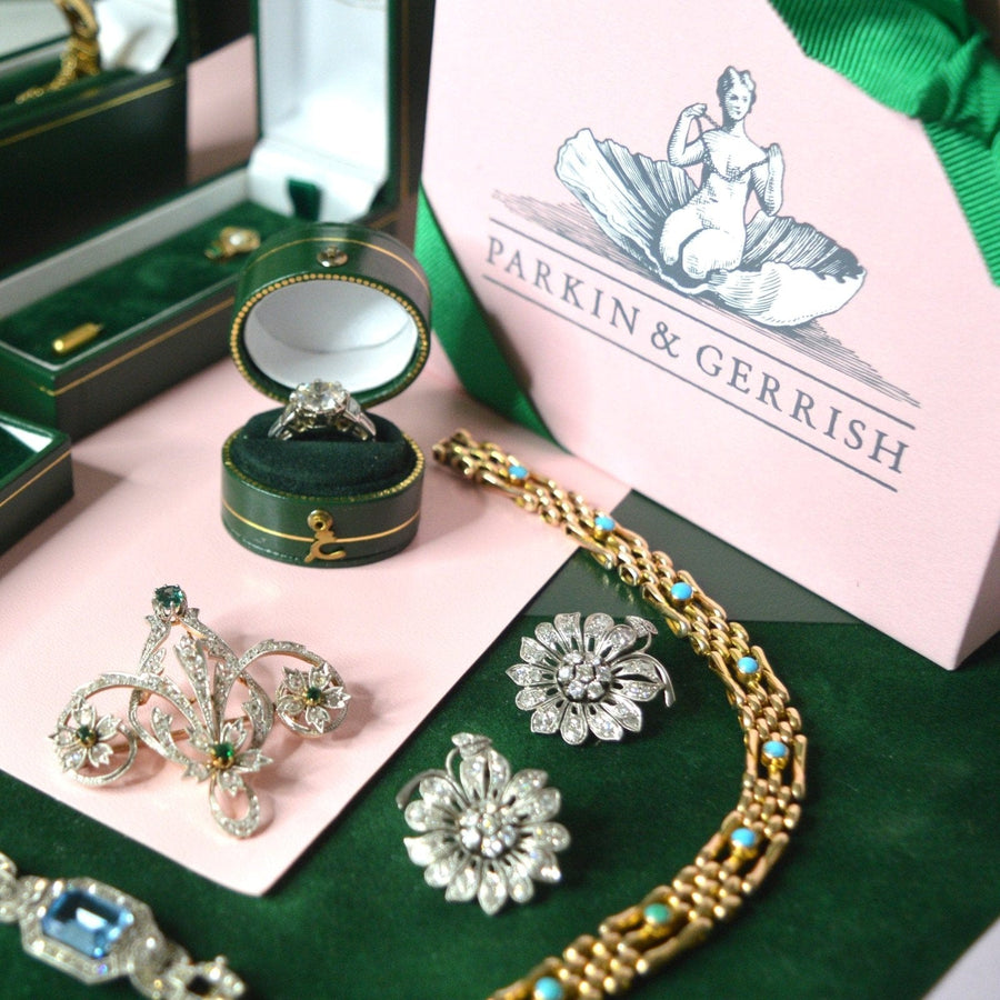 Vintage and antique jewellery from Parkin & Gerrish, including rings, brooches, and necklaces in elegant packaging.