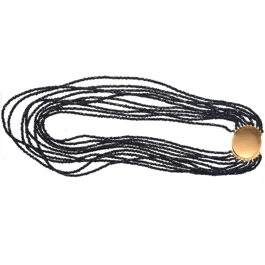Rare Georgian 9ct gold clasp multi-strand necklace with black beads and elegant design.