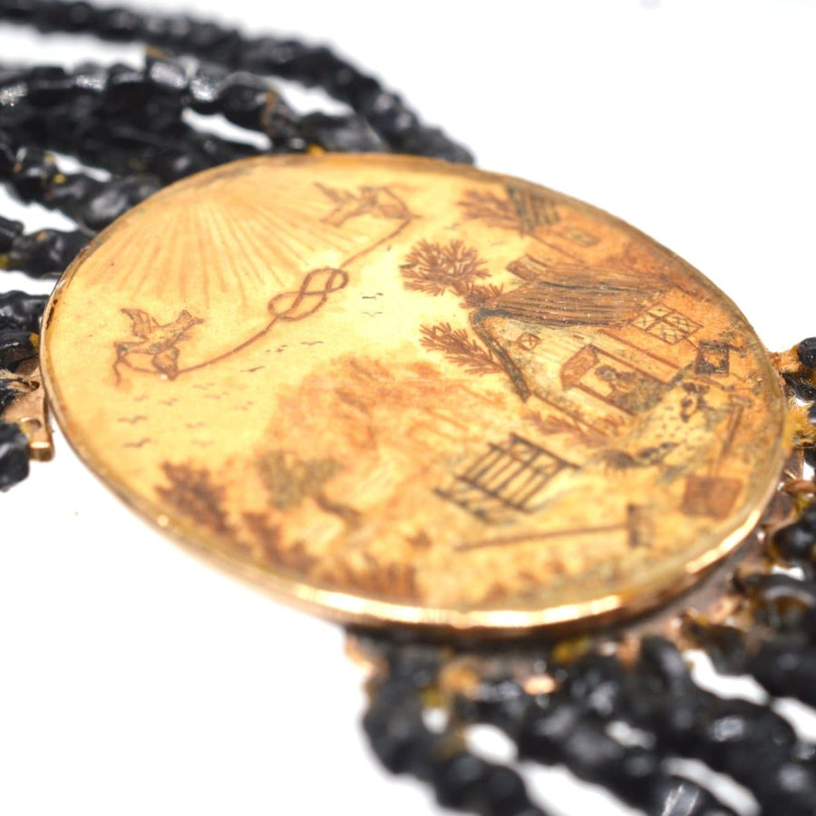 Rare Georgian 9ct gold clasp featuring pastoral scene and doves, part of a multi-strand Vauxhall glass necklace.