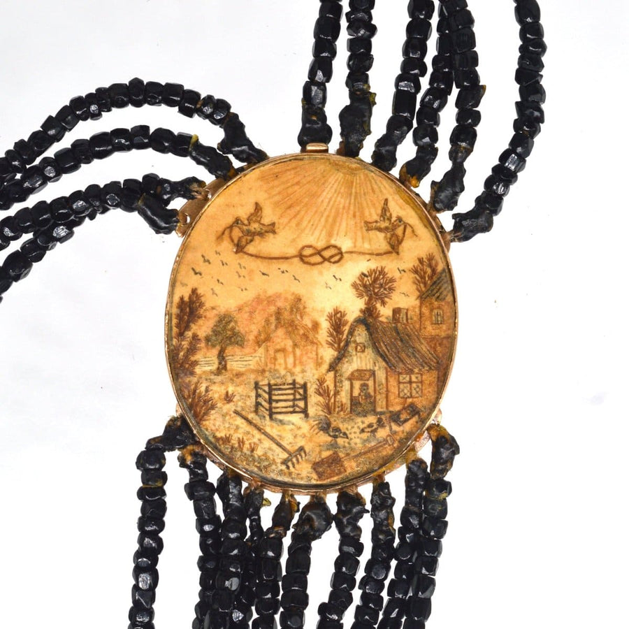 Rare Georgian 9ct gold clasp featuring pastoral scene with cottage, doves, and multi-strand Vauxhall glass necklace.
