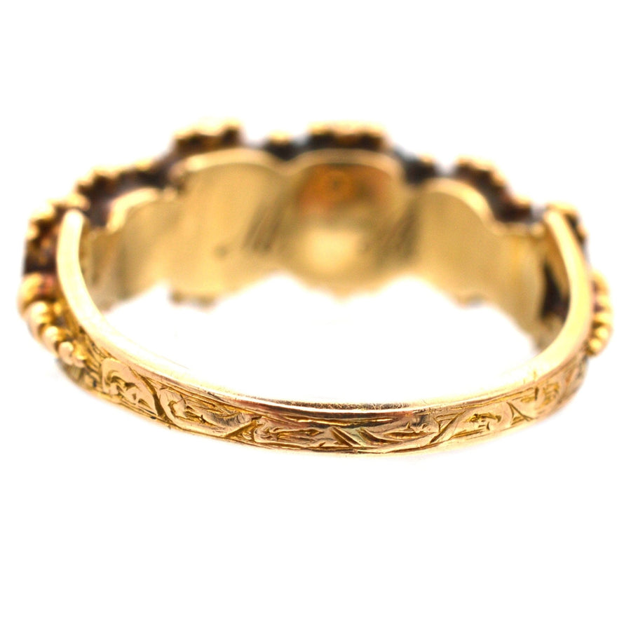 Back view of Regency 15ct gold acrostic ring featuring intricate design and gemstone settings spelling 'REGARD'.