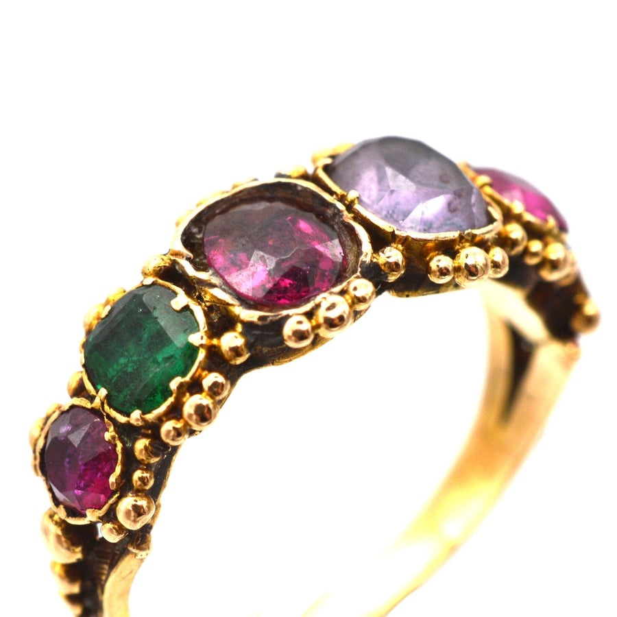 Regency gold acrostic ring featuring Ruby, Emerald, Amethyst, and Diamond, spelling 'REGARD'.