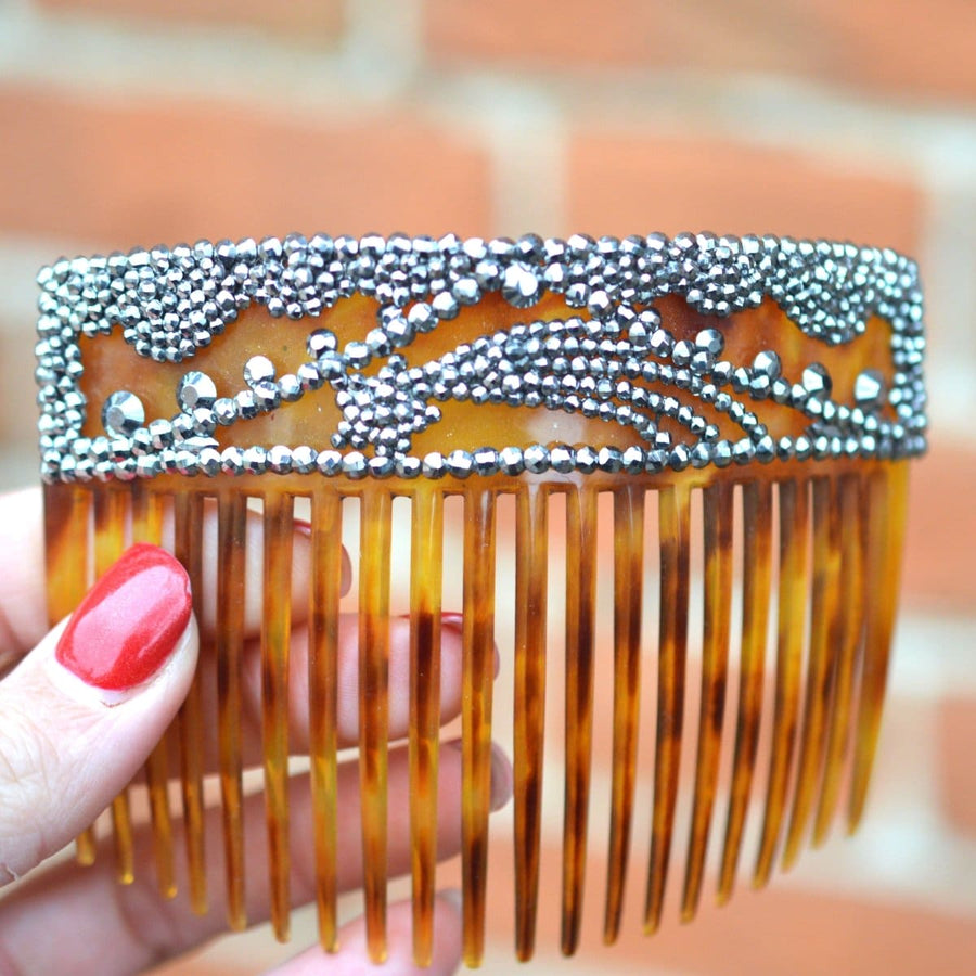 Regency tortoiseshell and cut steel hair comb with shooting star design, an elegant 19th-century adornment.
