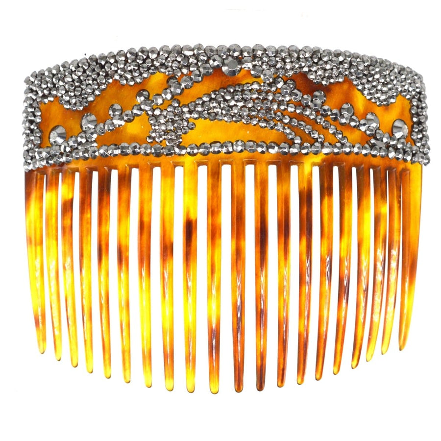 Regency tortoiseshell hair comb adorned with cut steel, featuring a shooting star design from the early 19th century.