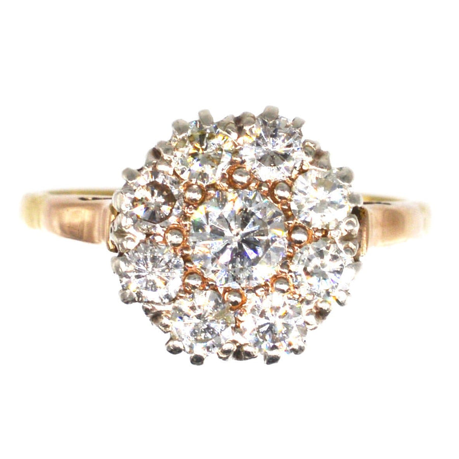 Vintage 18ct gold diamond cluster ring featuring 1.1 carats of bright, white diamonds in a timeless design.
