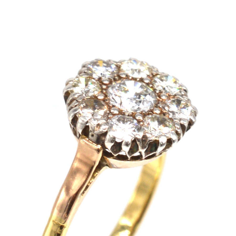 Vintage 18ct gold cluster ring featuring a 1.1 carat diamond centerpiece with sparkling accents, perfect for engagements.