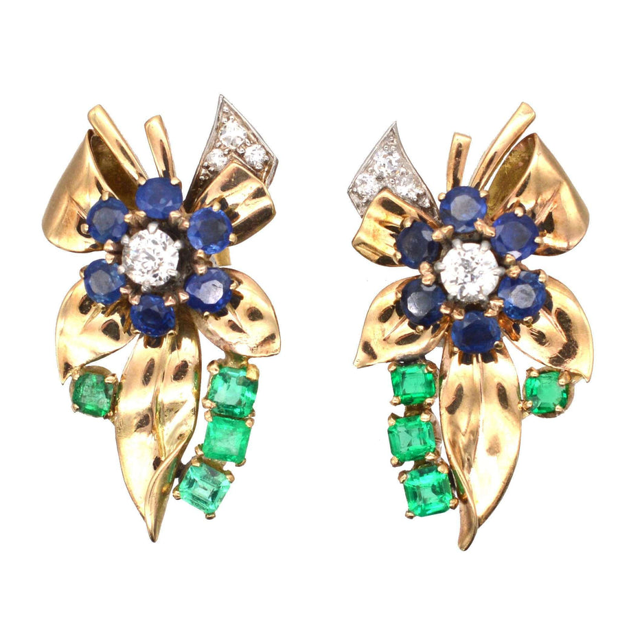 Retro 1940s gold Tutti Frutti earrings featuring emeralds, sapphires, and diamonds in a floral design.