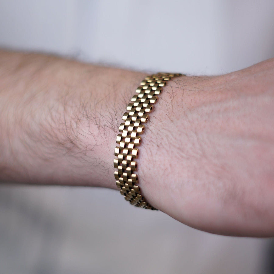 Retro 1940s 9ct gold tank bracelet showcased on a wrist, highlighting a timeless design influenced by Cartier.