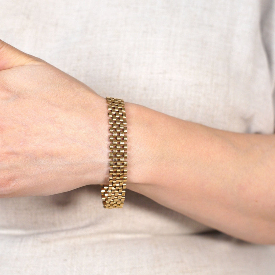 Retro 1940s 9ct gold tank bracelet worn on wrist showcasing classic design inspired by Cartier's tank style.