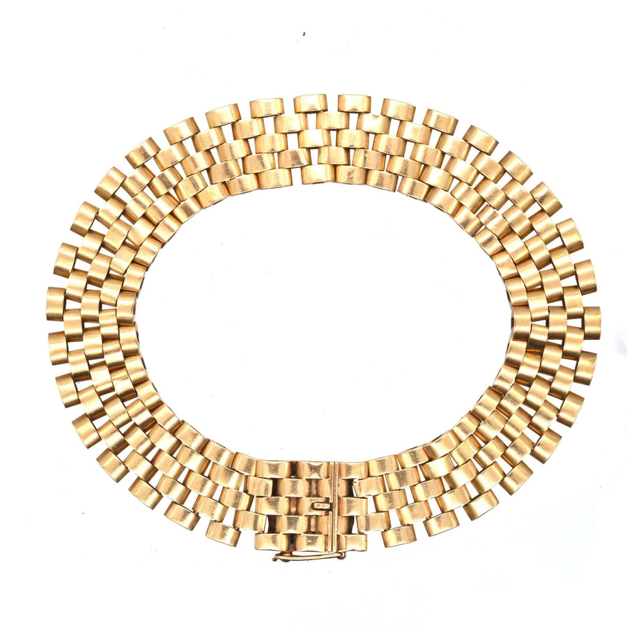 Retro 1940s 9ct gold tank bracelet showcasing timeless design inspired by Cartier's iconic style.