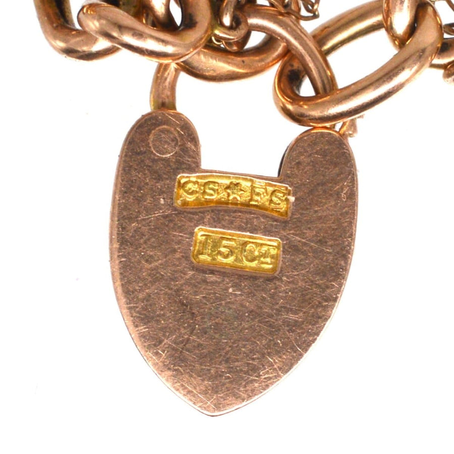 Heart lock of a Small Edwardian 15ct Gold Child's Curb Bracelet, showcasing intricate craftsmanship from the early 1900s.