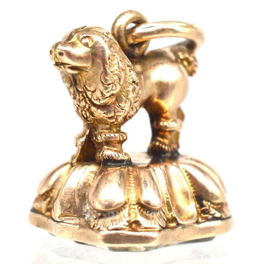 Small gold pendant featuring an elegant Georgian lion design, showcasing intricate details and a vintage charm.