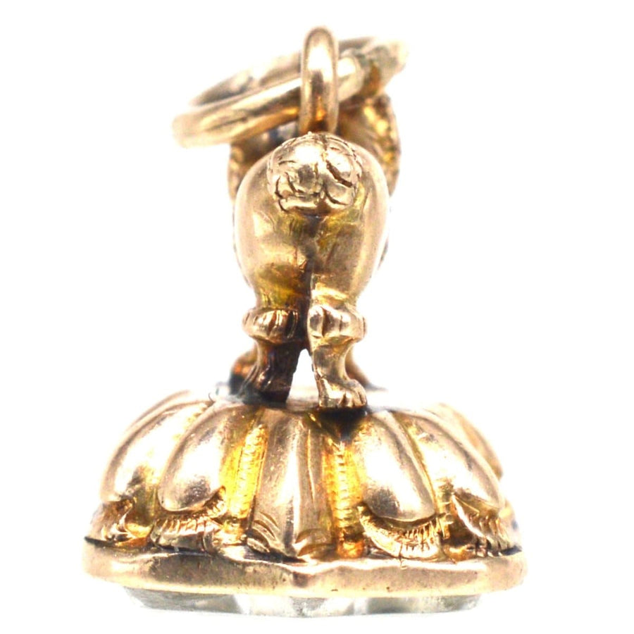 Small Georgian gold cased poodle pendant, antique charm with rock crystal seal, elegant canine treasure.