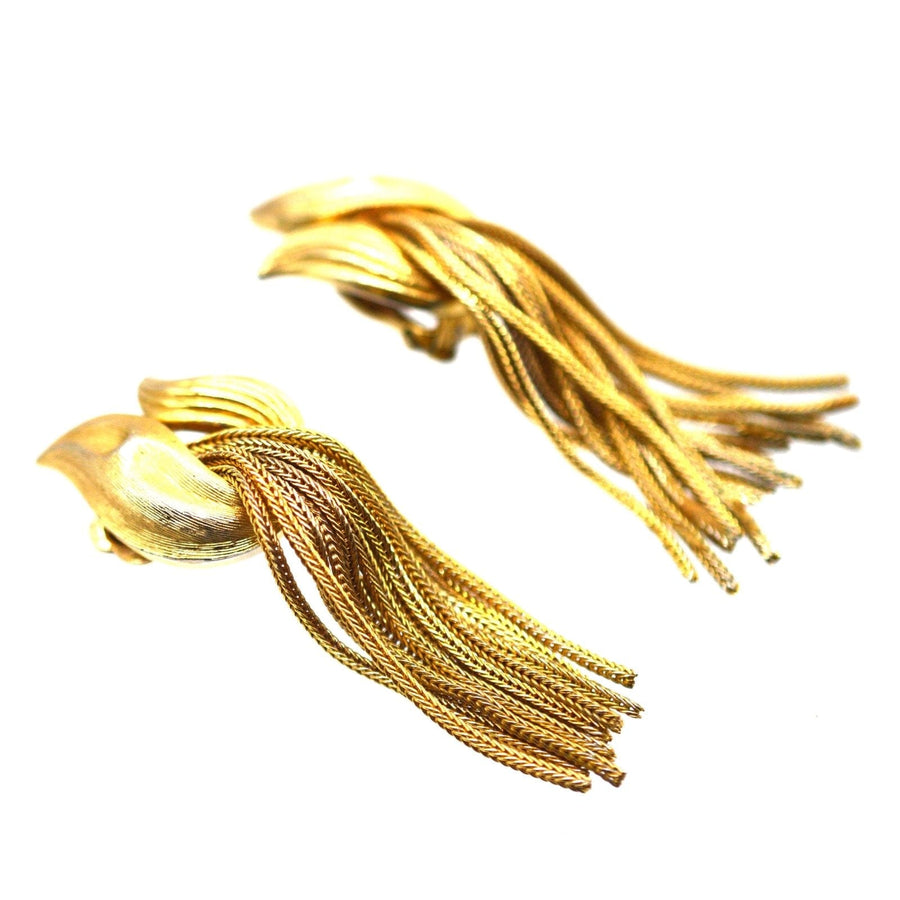 Vintage Trifari gold-tone tassel earrings from the 1950s, featuring intricate knot design and swinging tassels.