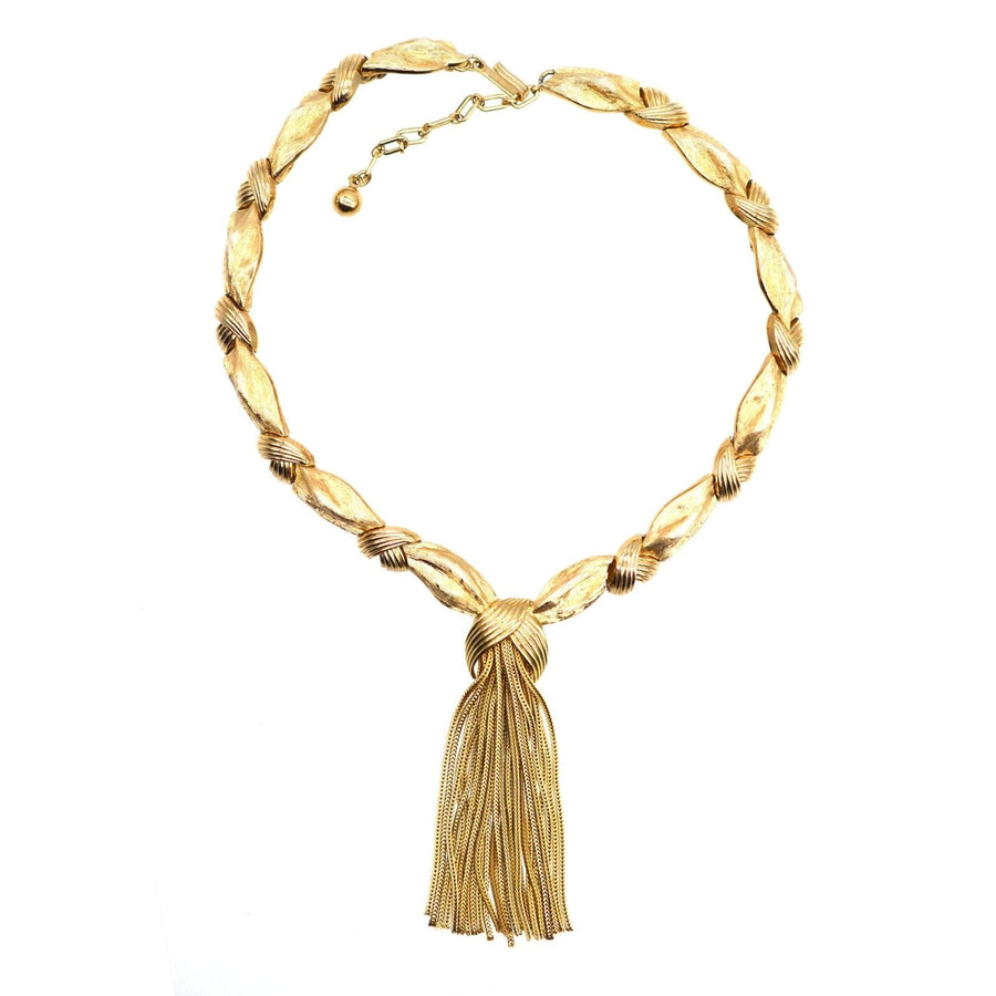 1950s Trifari gold-tone tassel necklace with elegant knot design, part of a demi-parure jewelry set.