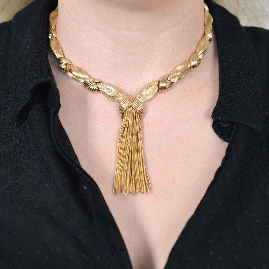 1950s gold-tone knot and tassel necklace from Trifari demi-parure set worn on model