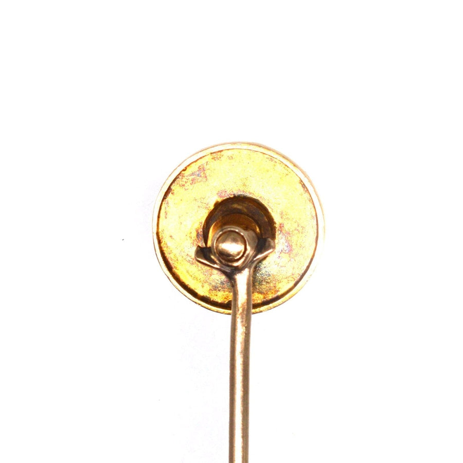 Victorian 15ct gold circle tie pin showcasing the back with a gold swirl design, featuring a slot for the pin.