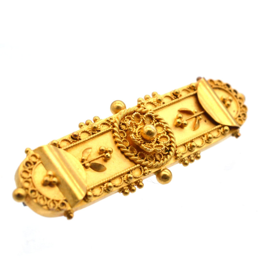 Victorian 15ct Gold Etruscan Revival Bar Brooch with intricate decorative design, circa 1870s.