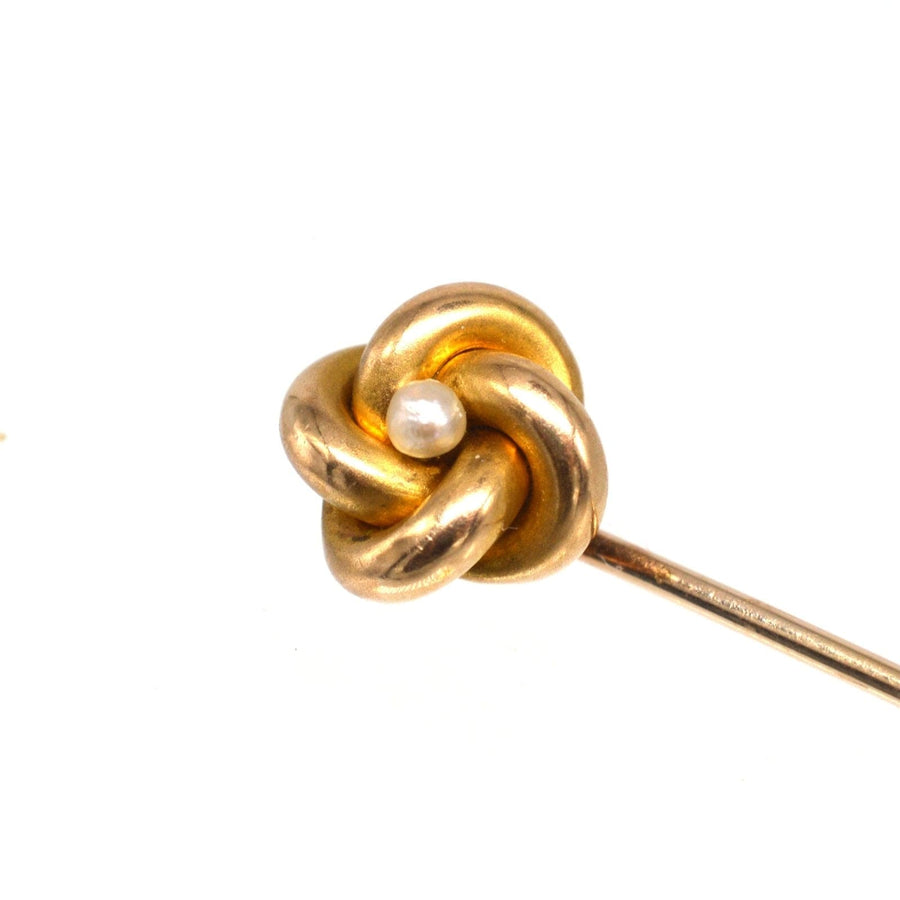 Victorian 15ct gold knot tie pin with a pearl, symbolizing everlasting love and timeless elegance.