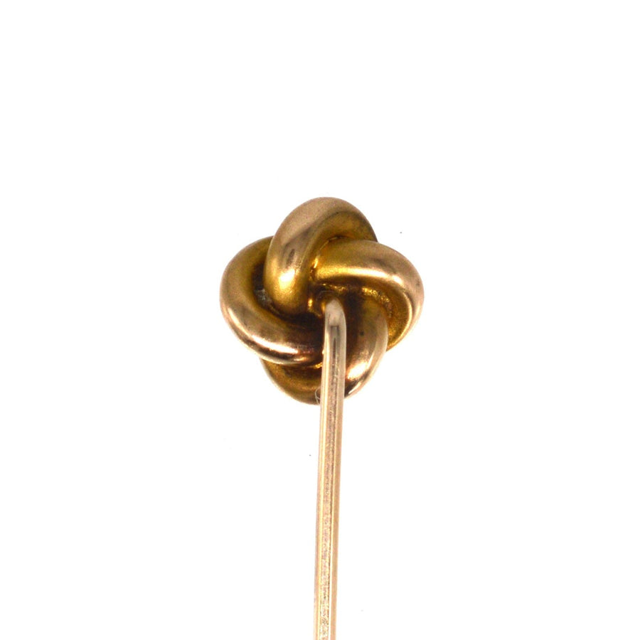 Victorian 15ct gold knot tie pin with pearl, symbolizing everlasting love and timeless elegance.