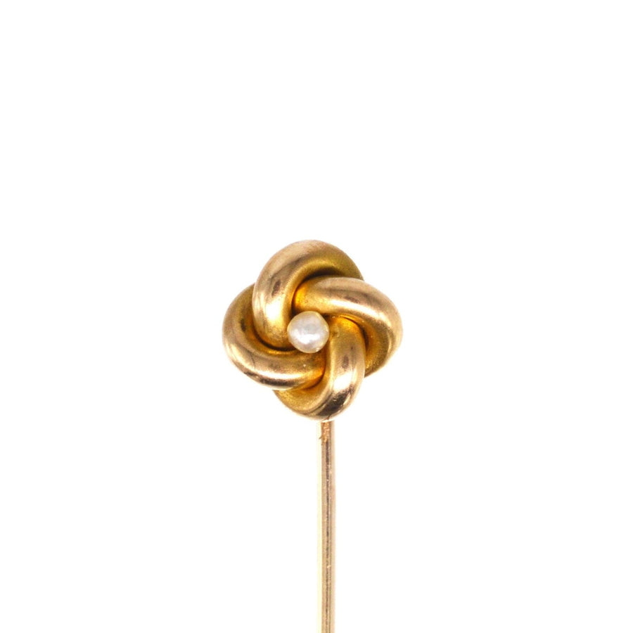 Victorian 15ct gold knot tie pin with a pearl, symbolizing love and strength, timeless elegance.