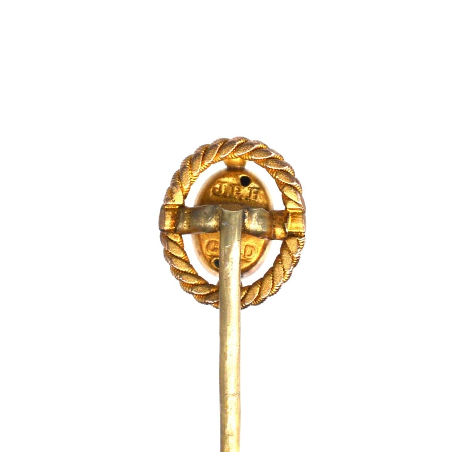Victorian 15ct gold tie pin with openwork rope design and stopper, featuring a ruby star from Birmingham, circa 1880.