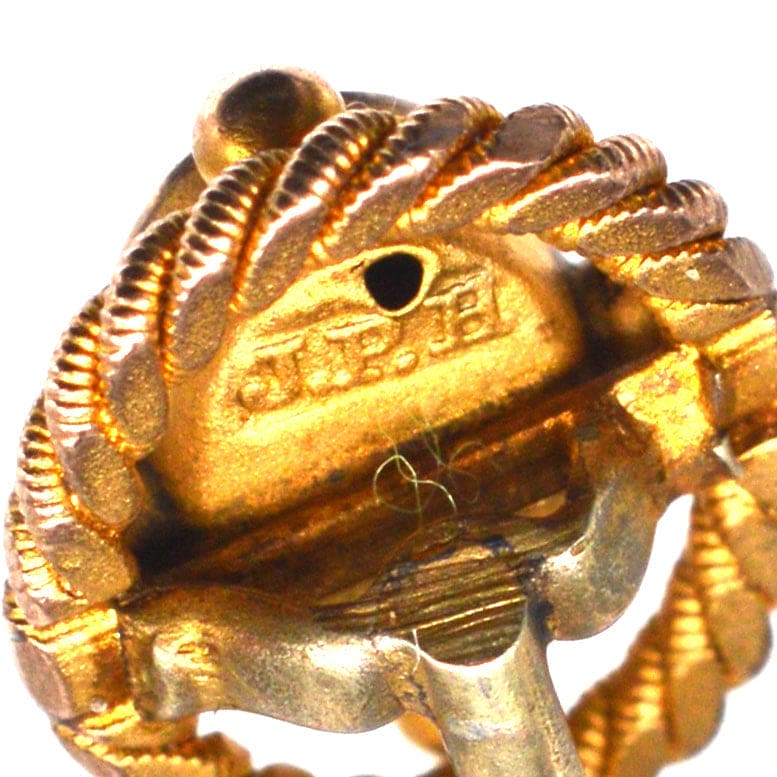 Close-up of a Victorian 15ct gold tie pin with openwork rope design and maker's mark from John Price Hunt.