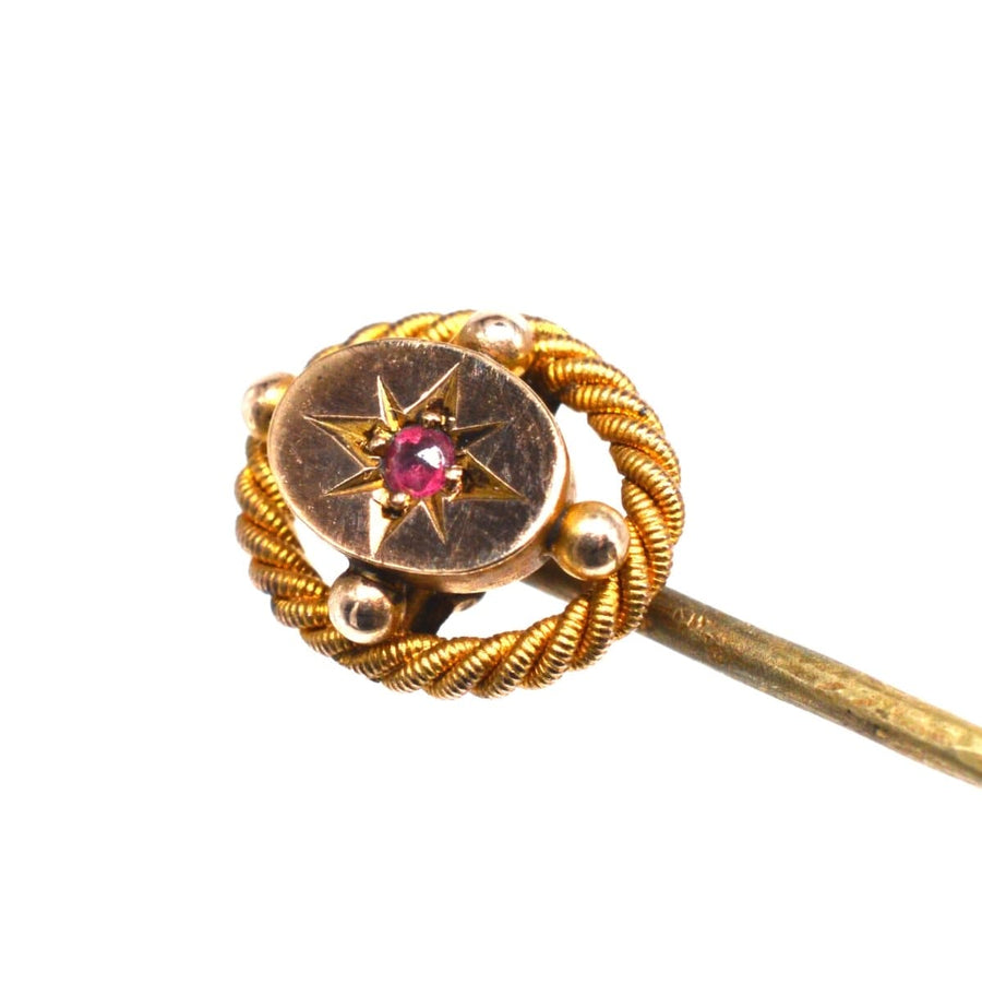 Victorian 15ct gold tie pin featuring a ruby star, designed by John Price Hunt, circa 1880 with an openwork rope design.