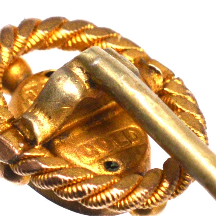 Victorian 15ct gold tie pin with openwork rope design and ruby star setting, circa 1880.