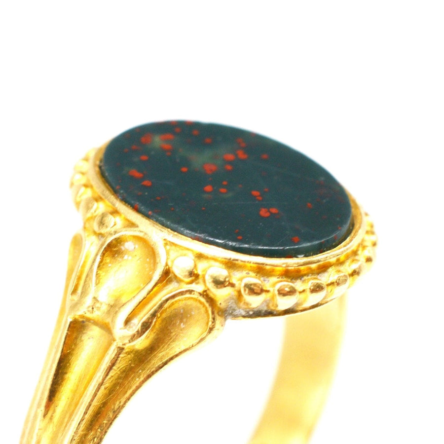Victorian 18ct gold bloodstone signet ring featuring ornate shoulders, perfect for engraving or display.