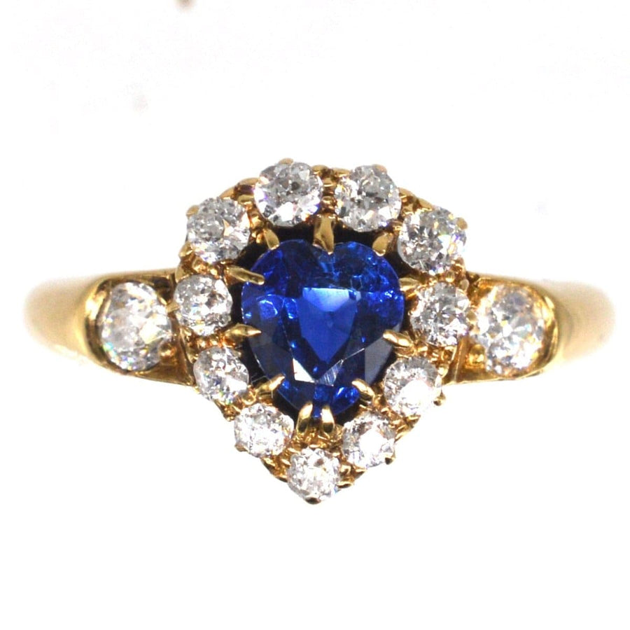 Victorian 18ct gold heart-shaped sapphire and diamond cluster ring with stunning blue center and sparkling surrounding diamonds.