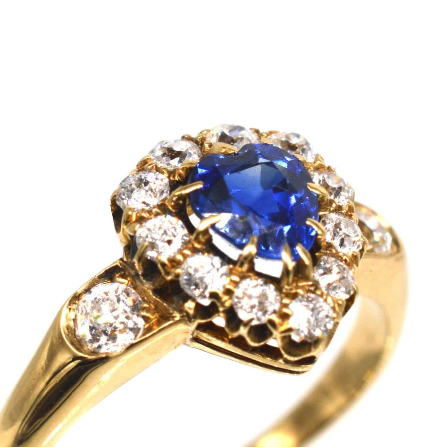 Victorian heart-shaped sapphire and diamond cluster ring in 18ct gold, showcasing exquisite craftsmanship and elegance.