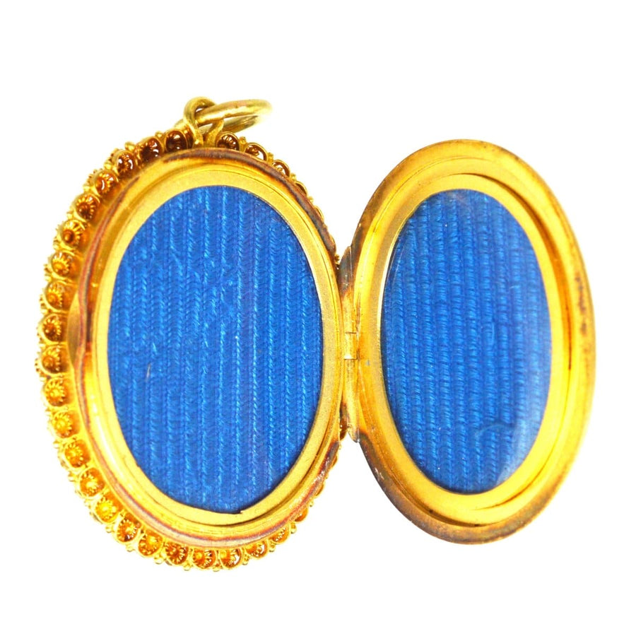 Victorian 18ct gold locket interior with blue compartments, perfect for storing precious photos.