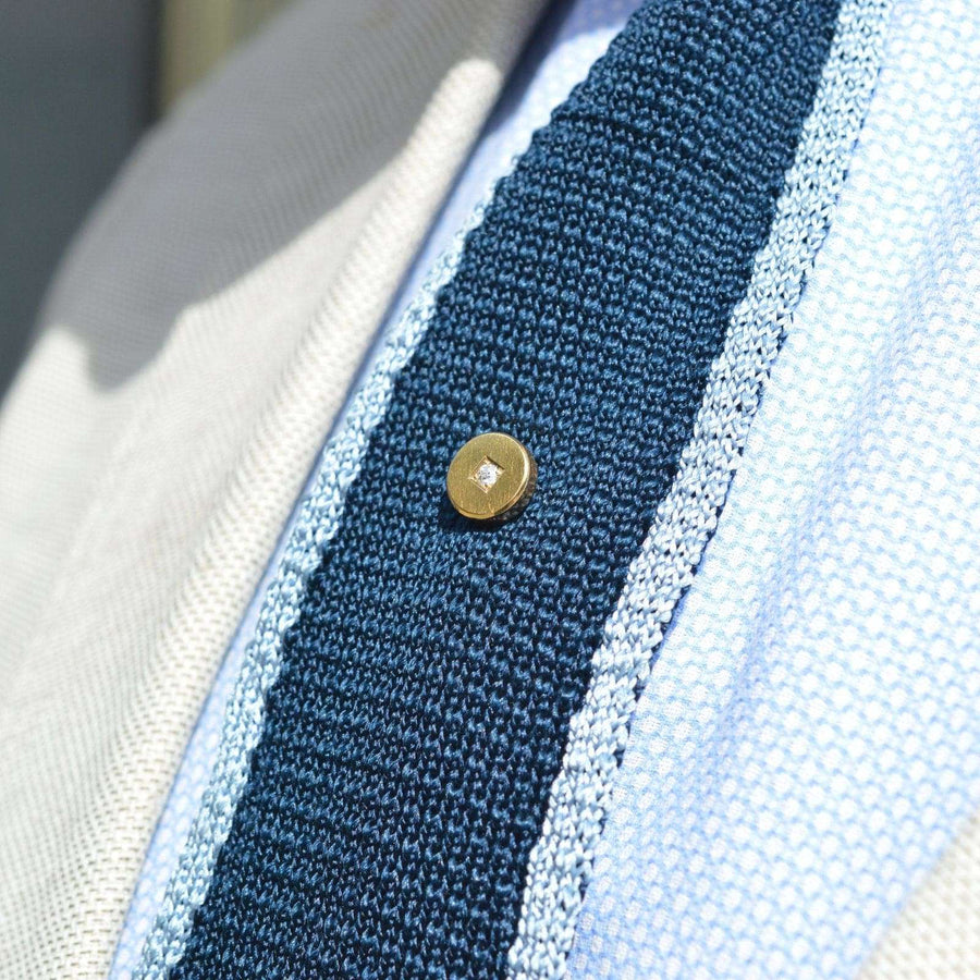 Victorian 18ct gold round tie pin with diamond on a knit tie, showcasing timeless elegance for the modern gentleman.