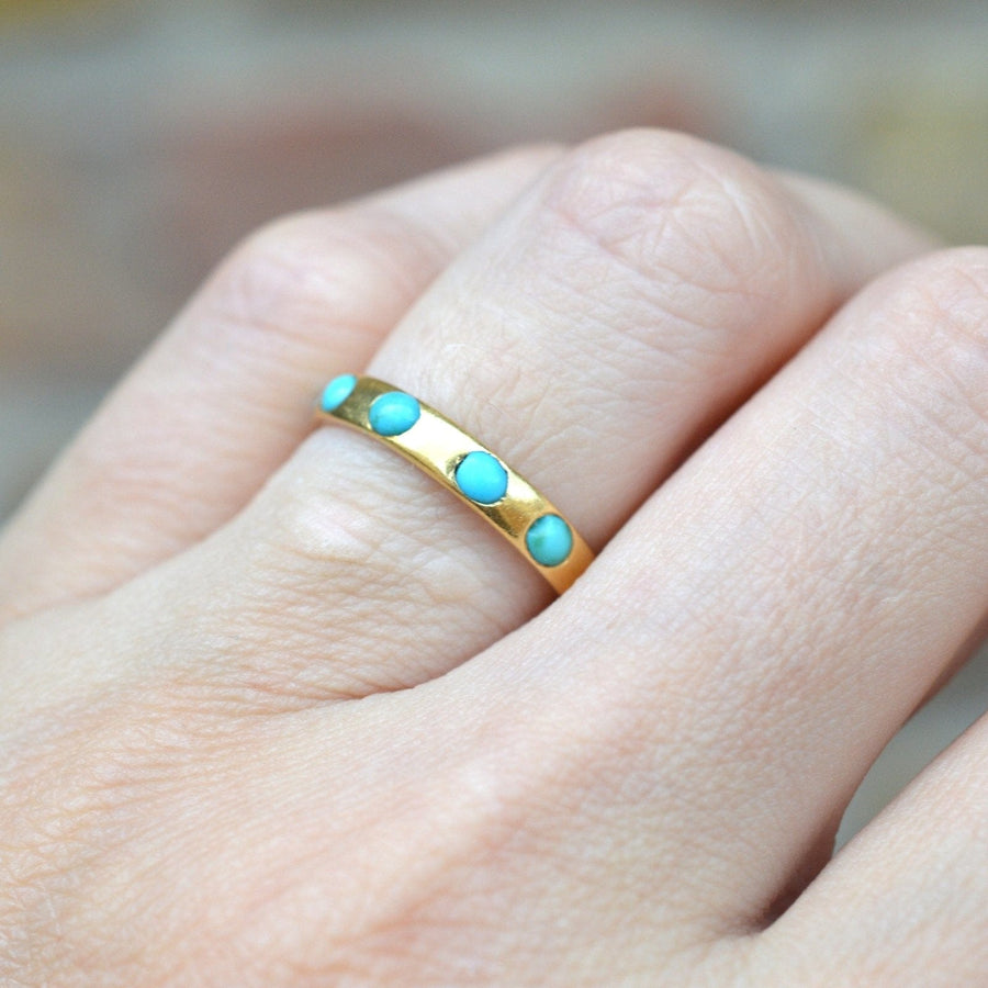 Victorian 18ct gold eternity ring featuring turquoise stones, perfect for stacking or as a unique gift.