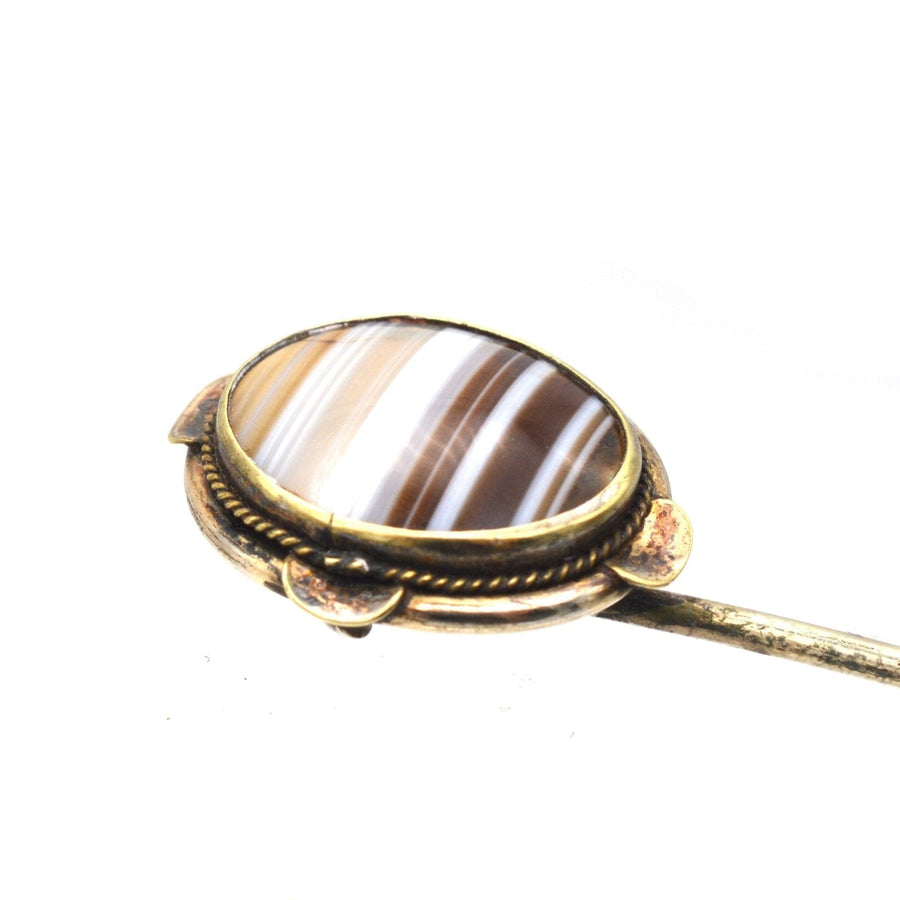 Victorian 9ct gold banded agate tie pin, showcasing intricate agate patterns and a classic frame design.