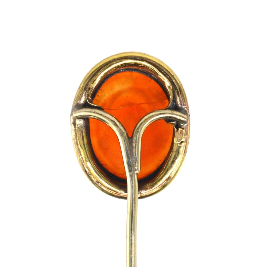 Victorian 9ct gold carnelian tie pin featuring a crescent moon and stars, symbolizing new beginnings and love.