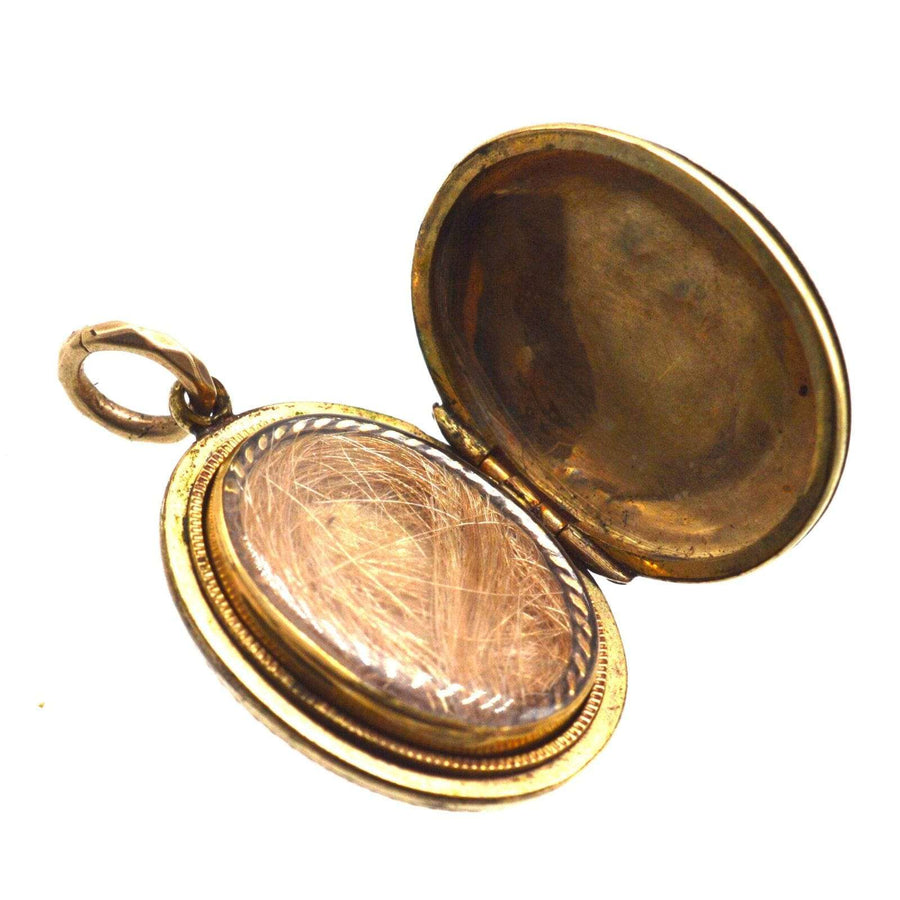 Victorian 9ct gold floral locket with two compartments, featuring rose and ivy designs, perfect for keepsakes.