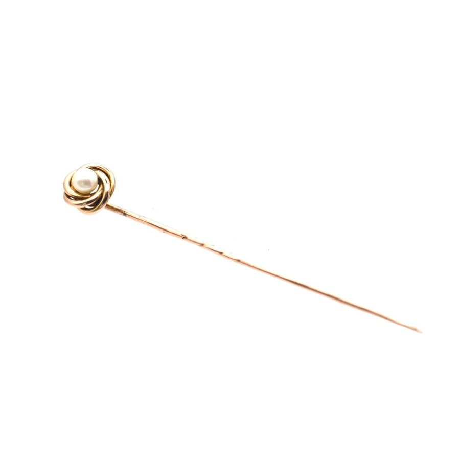 Victorian 9ct gold knot twist tie pin featuring a lustrous pearl, elegant accessory from the 1880s.