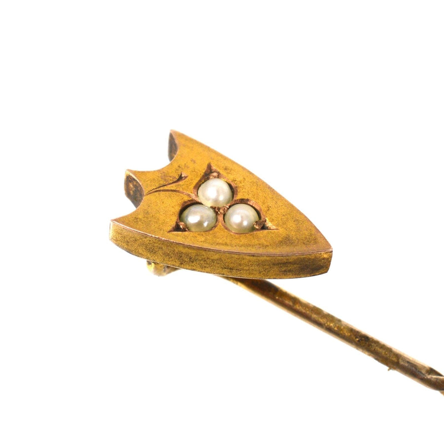 Victorian 9ct gold shield tie pin with split pearl leaf design, showcasing three pearls set in a classic shield shape.