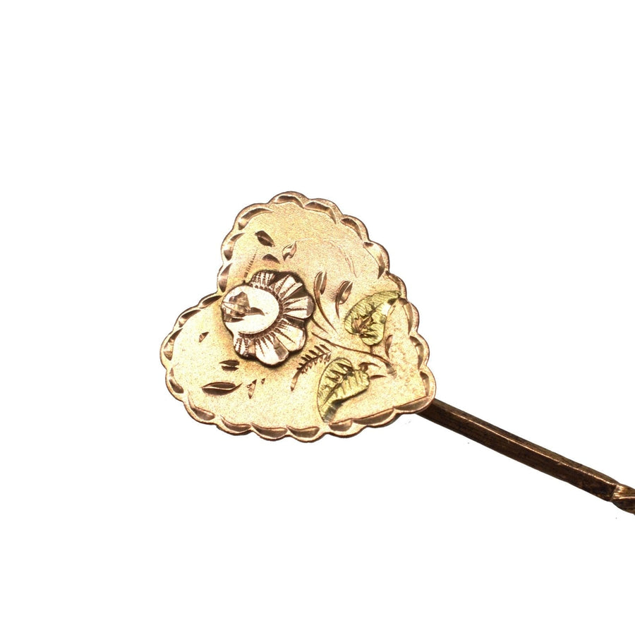 Victorian 9ct gold tie pin featuring a heart shape and a detailed rose motif, highlighting exquisite craftsmanship.