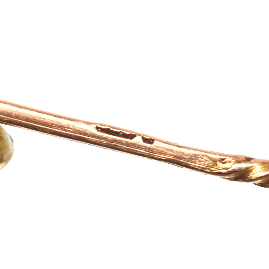 Close-up of Victorian 9ct gold tie pin showing hallmark and intricate twisted design.