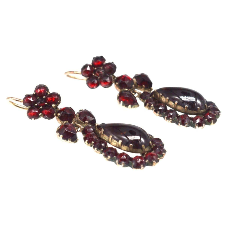 Victorian gold earrings featuring Bohemian garnets, elegantly designed with rose-cut gemstones and floral accents.