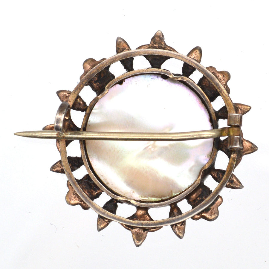 Victorian silver gilt brooch with mother of pearl and sunburst design, circa 1860-1880.