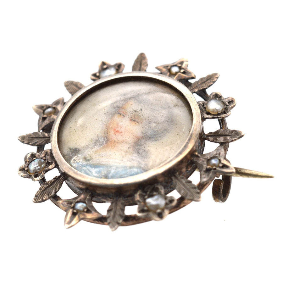 Victorian Neoclassicism brooch featuring a hand-painted miniature portrait of a Georgian lady on mother of pearl.