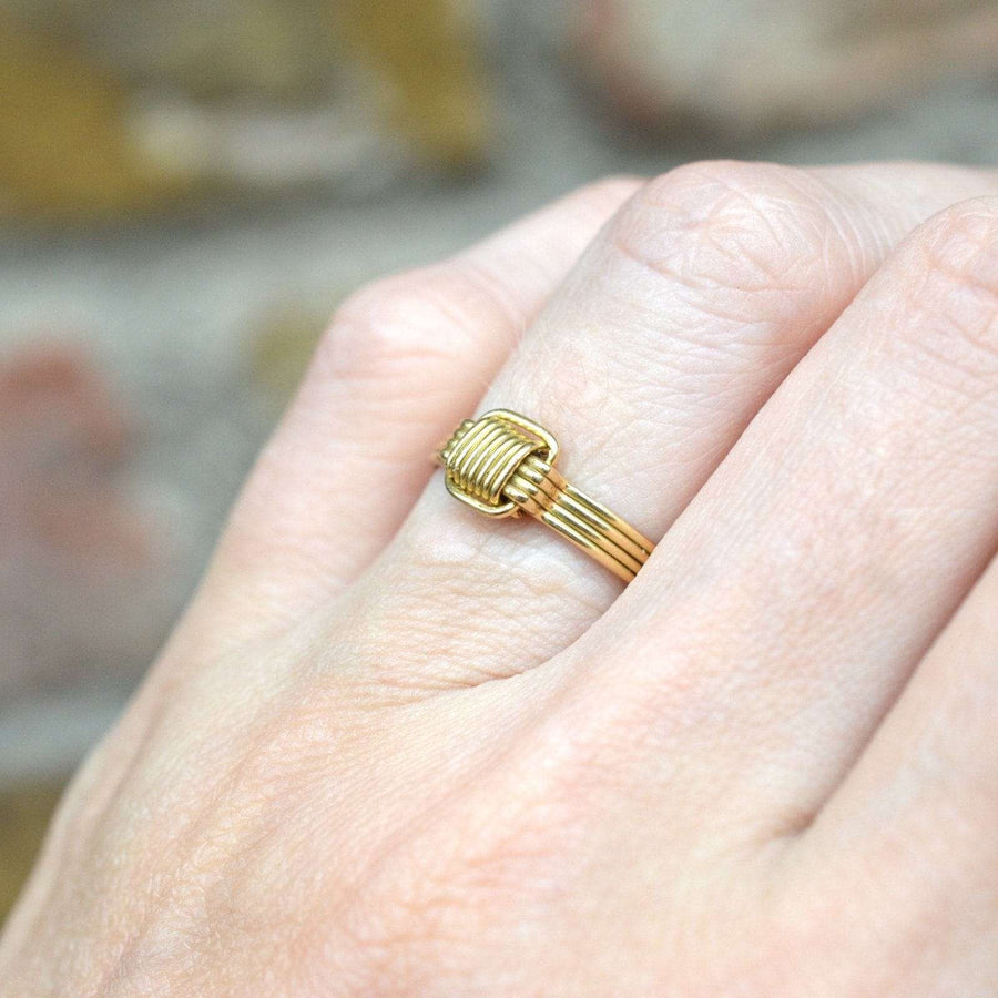 Vintage 1970s 18ct gold elephant hair ring showcasing polished gold wires on a hand.
