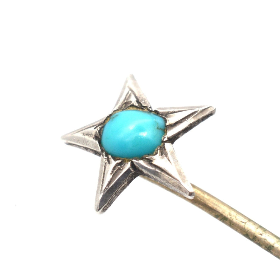 Victorian silver star tie pin featuring a turquoise center, symbolizing love and remembrance.